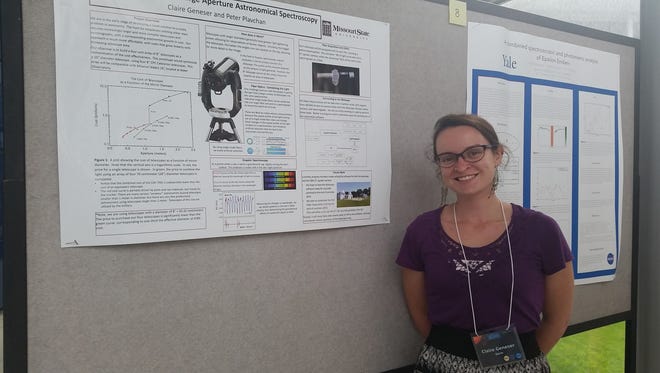 Geneser stands in front of her poster at the Yale EPRV conference