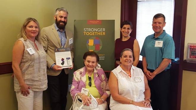Nonprofit community developers, local officials and residents came together to unveil the “Middlesex County Stronger Together” report. Pictured standing from left to right standing are Leslie Stivale, executive director, Triple C Housing; Matthew Hersch, board member, Highland Park Housing Authority; Staci Berger, president-CEO, Housing and Community Development Network of NJ, and Brian Kulas, housing advocate. Seated are Middlesex County Freeholder Blanquite Valenti and New Brunswick Councilwoman Rebecca Escobar.