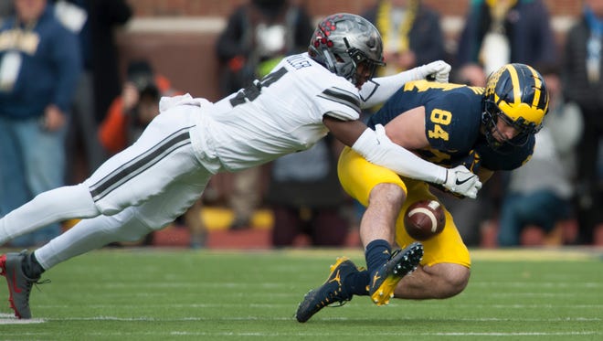 Michigan tight end Sean McKeon drops this pass while under pressure from Ohio State cornerback Jordan Fuller.