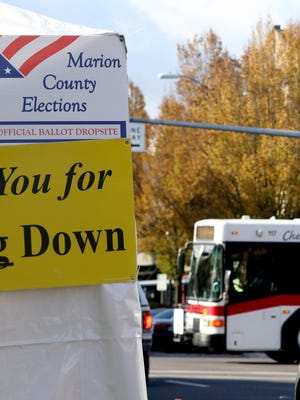Cherriots buses drive past drop-off ballot sites in downtown Salem on Election Day, Nov. 3.