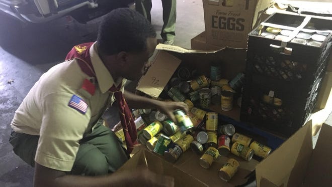 Boxes are bought in from Troop 441 to the Mid-South Food Bank on Nov. 17.