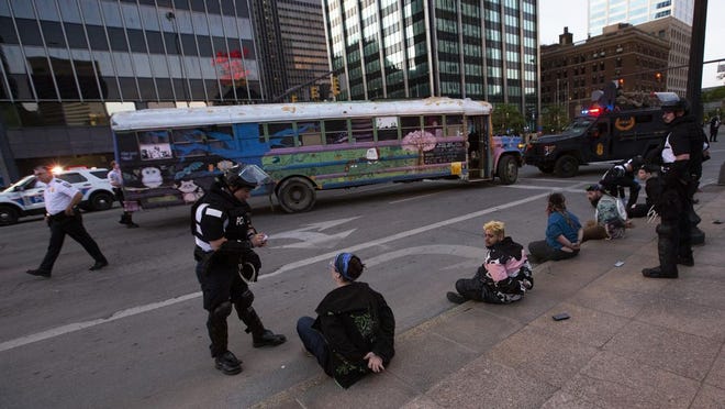 A group of protesters on a bus were briefly detained by police in Downtown Columbus on Sunday, May 31.