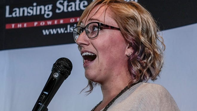 Michigan State University doctoral student Anna Groves tells her tale at the Lansing Storytellers Project event on March 21, 2017.