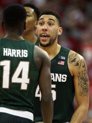 Jan 17, 2016; Madison, WI, USA; Michigan State Spartans guard Denzel Valentine (45) talks to teammate guard Eron Harris (14) during the game against the Wisconsin Badgers.