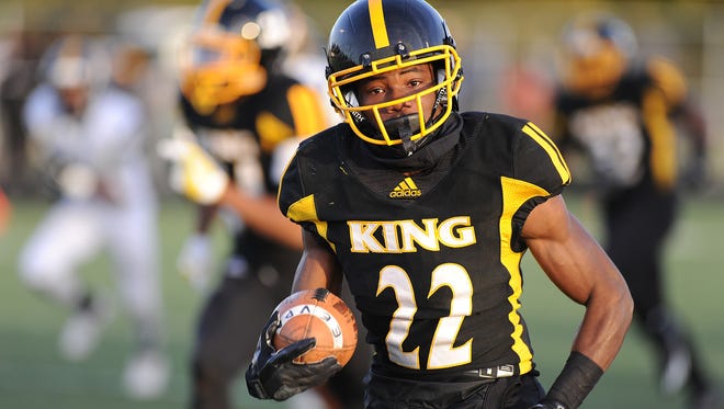 Detroit King's Jae'Veyon Morton runs back an East English Village punt for a touchdown in the first half of King's victory Friday in a Division 2 district final.