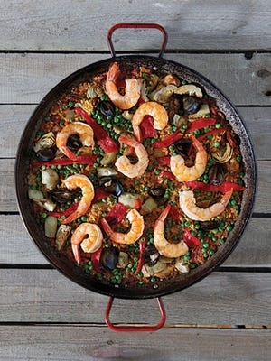 Ken Gluckman specializes in creating a variety of authentic Spanish paellas.
