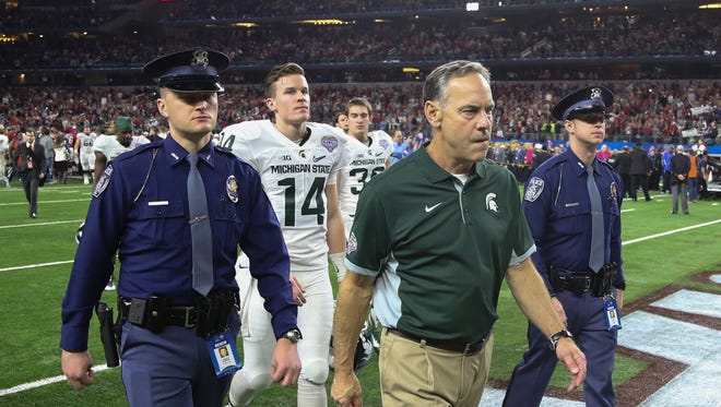 Michigan State head coach Mark Dantonio leaves the field after the 38-0 loss to Alabama in the Good Year Cotton Bowl game December 31, 2015 at AT&T Stadium in Arlington Texas.