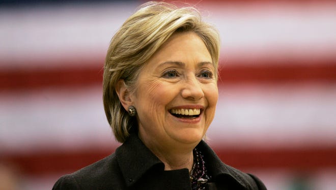 FILE - In this Dec. 31, 2007, file photo, then-Democratic presidential hopeful Sen. Hillary Rodham Clinton, D-N.Y., smiles while speaking at a campaign stop at Muscatine West Middle School in Muscatine, Iowa. Clinton last left Iowa on an ?excruciating? night, the beginning of the end of her White House campaign. She returns for the first time this weekend, not quite yet running for president, but sure to hear cheers from a crowd of Democrats hoping she will.