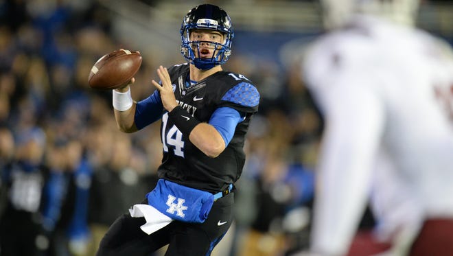 UK QB Patrick Towles scrambles during the first half of the University of Kentucky Wildcats Football game against the South Carolina Gamecocks in Lexington, KY. Saturday, October 4, 2014.
