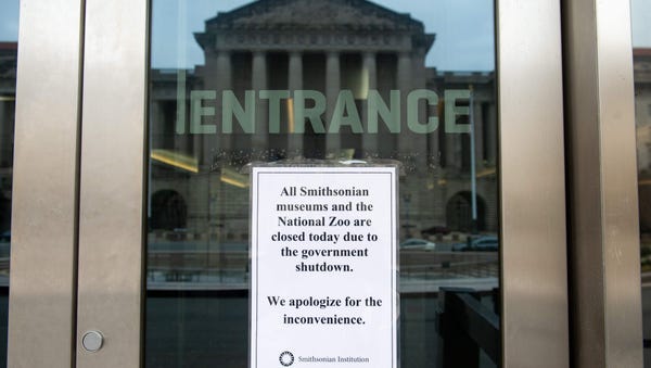 A sign hangs on the door of the Smithsonian...