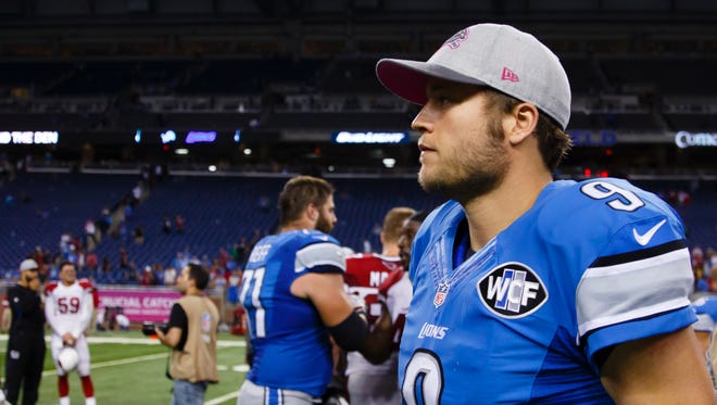 Detroit Lions quarterback Matthew Stafford walks off the field after a game against the Arizona Cardinals at Ford Field in Detroit on Sunday, Oct. 11, 2015.