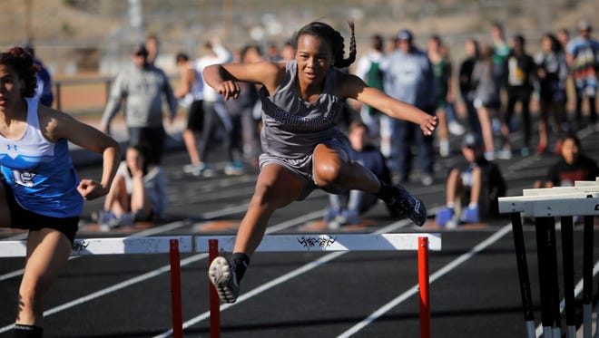 Shiprock's Ashinee George leaps over the first hurdle during the third heat of the girls 100-meter hurdles at Thursday's Top Gun Invitational in Aztec. Visit daily-times.com to see the latest results, photo galleries and sports video highlights.