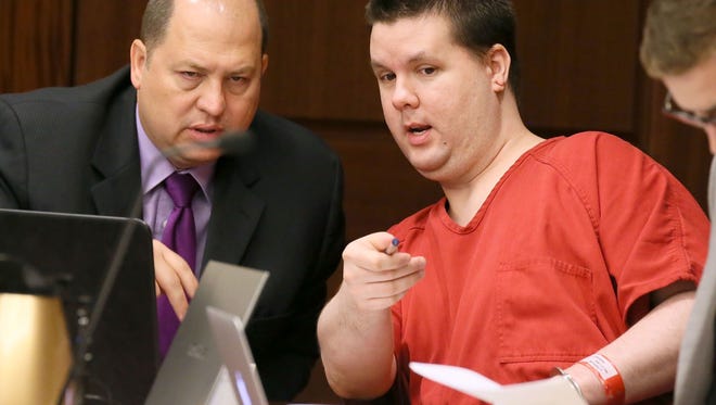 In this Sept. 15, 2015 file photo, Justin Ross Harris, right, motions to a image on a laptop on the defendants tables to one of his attorneys, T. Bryan Limpkin, as the pre-trial motion hearings continue in Marietta, Ga.  The trial for Harris, accused of intentionally leaving his toddler son in a hot SUV to die is set to begin Monday, April 11, 2016.  Harris is accused of leaving 22-month-old Cooper to die in June 2014. He's been held without bond since then on multiple charges, including murder. His attorneys have called the death a tragic accident.