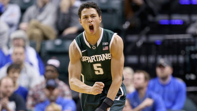 Bryn Forbes of the Michigan State Spartans celebrates after making a three-point shot during the game against the Duke Blue Devils in on Tuesday, Nov. 18, 2014, in Indianapolis.
