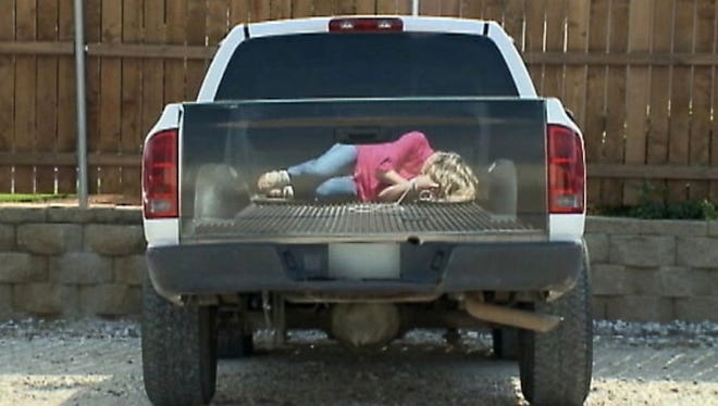 This tailgate decal from the back of a pickup truck depicting a bound woman was part of Hornet Signs "experiment in marketing."