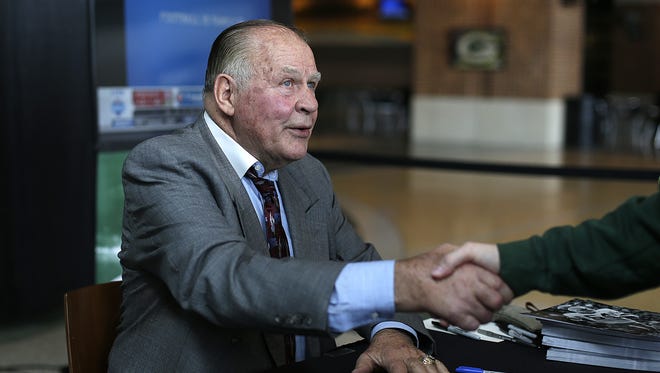 Green Bay Packers alumni Jerry Kramer greets a fan as he signs autographs during the Packers Draft party inside the Lambeau Field Atrium on Saturday, April 29, 2016.