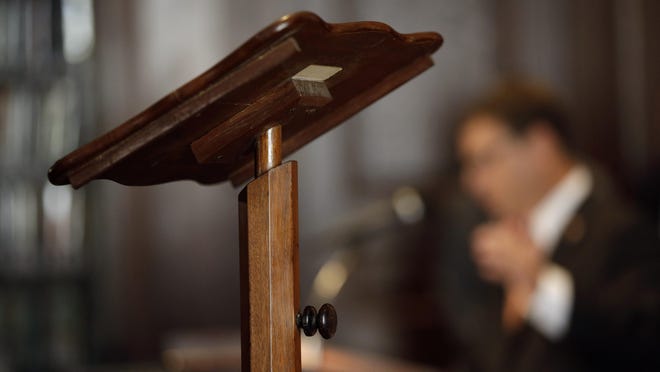 The lectern President Abraham Lincoln used to deliver the Gettysburg Address is seen as John Meko, with The Union League of Philadelphia, speaks during a news conference, Friday, Aug. 7, 2015, in Philadelphia. Pope Francis will use the lectern when he speaks outside Philadelphia's Independence Hall in September. (AP Photo/Matt Slocum)