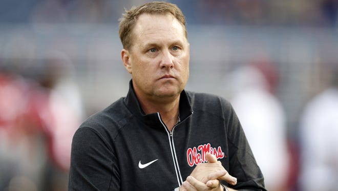 Ole Miss coach Hugh Freeze does not like the idea of players signing in June.