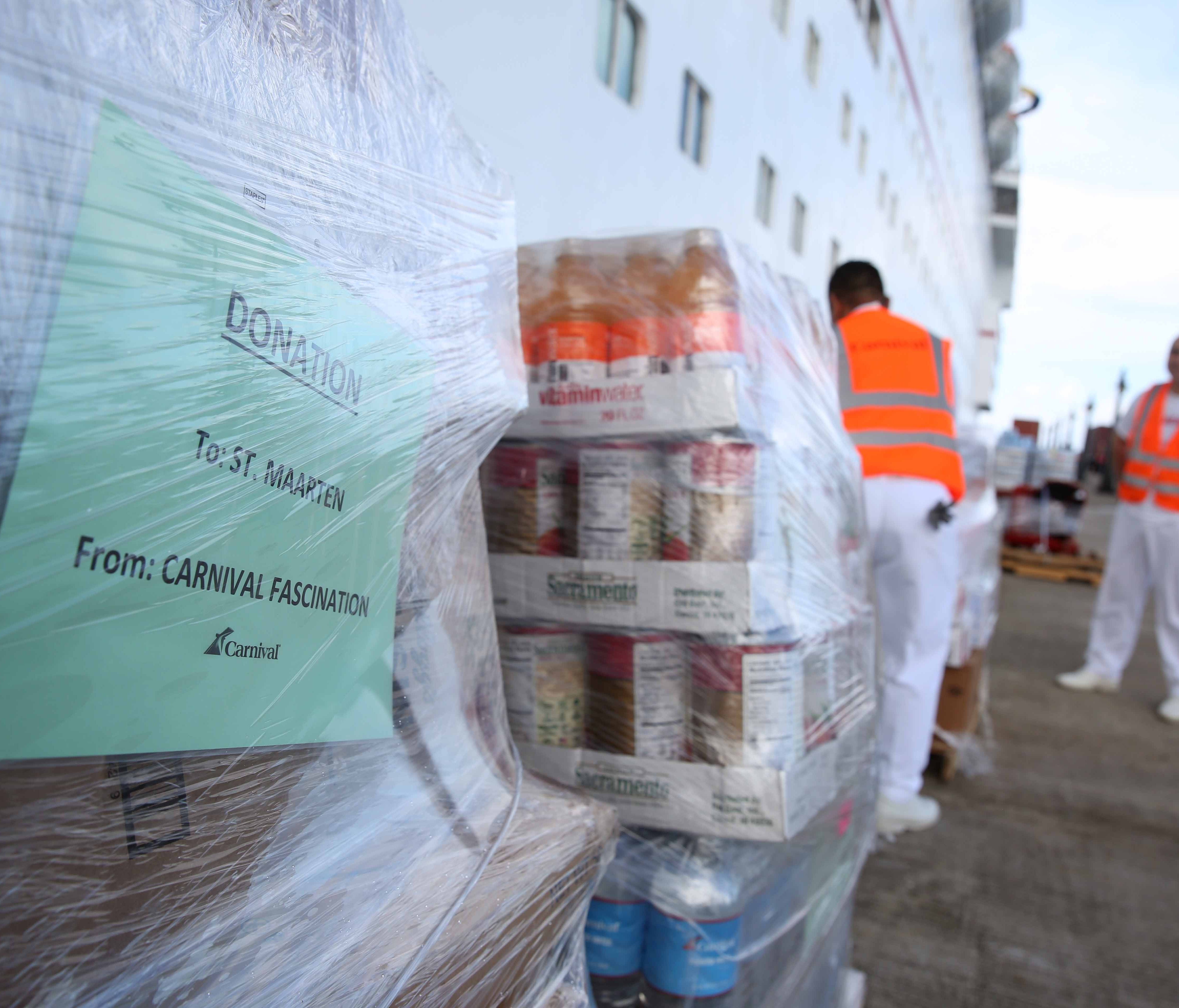 Relief supplies for hurricane-ravaged St. Maarten are unloaded from a Carnival cruise ship in the nearby island of St. Kitts.