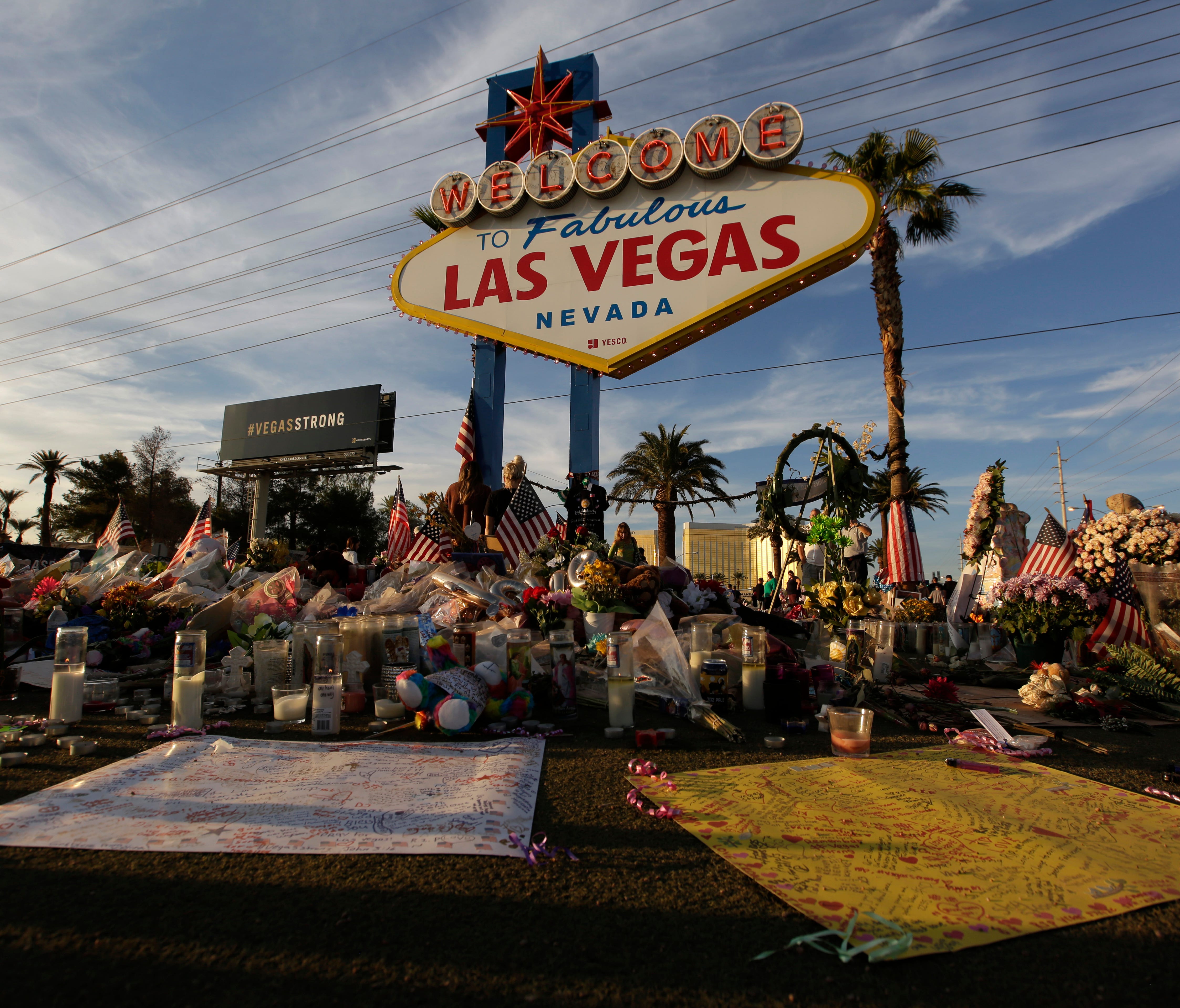 People visit a makeshift memorial for victims of the mass shooting in Las Vegas, on Oct. 16, 2017.