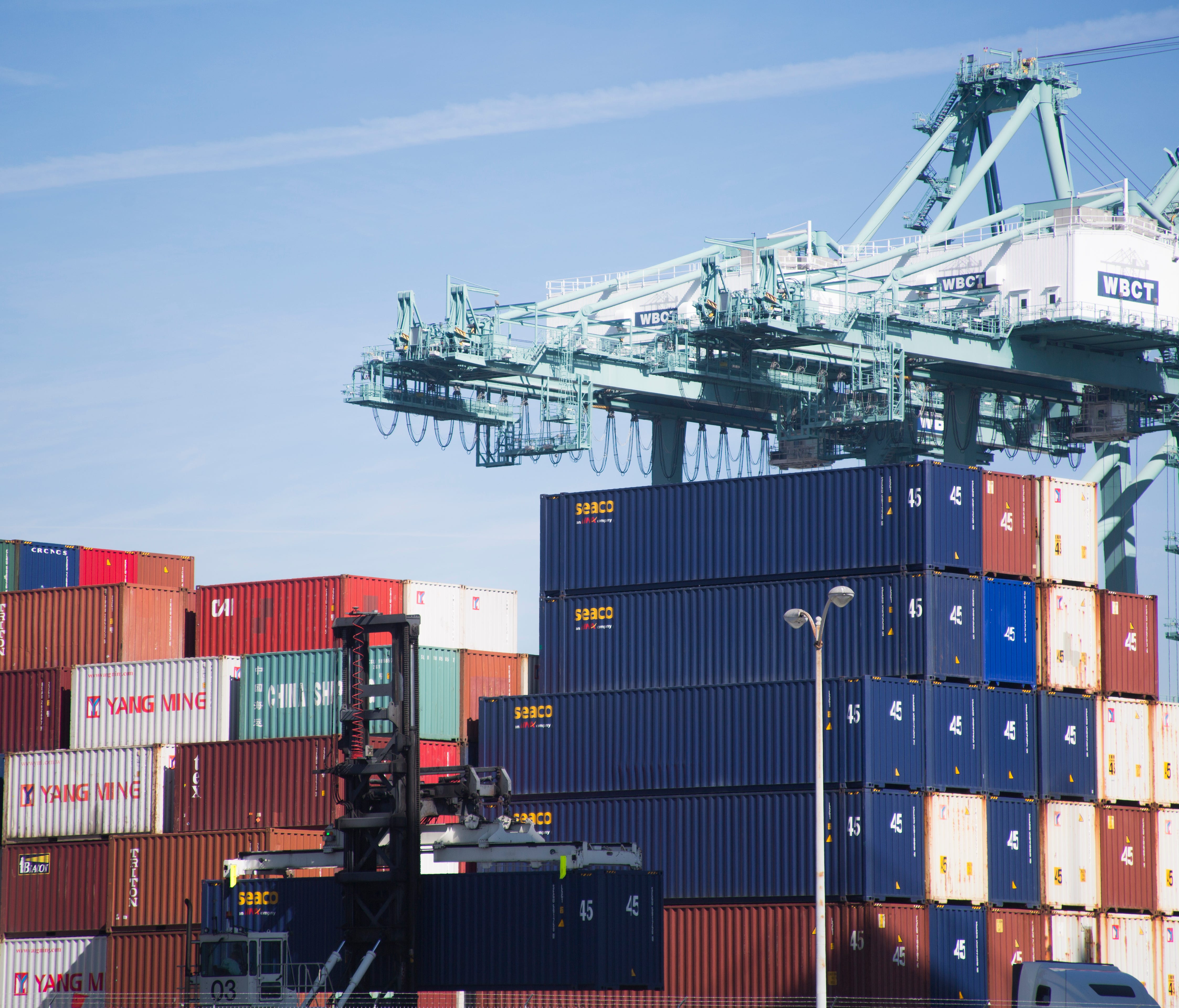 Containers are stacked and stored after being unloaded from ships in the Port of Long Beach.