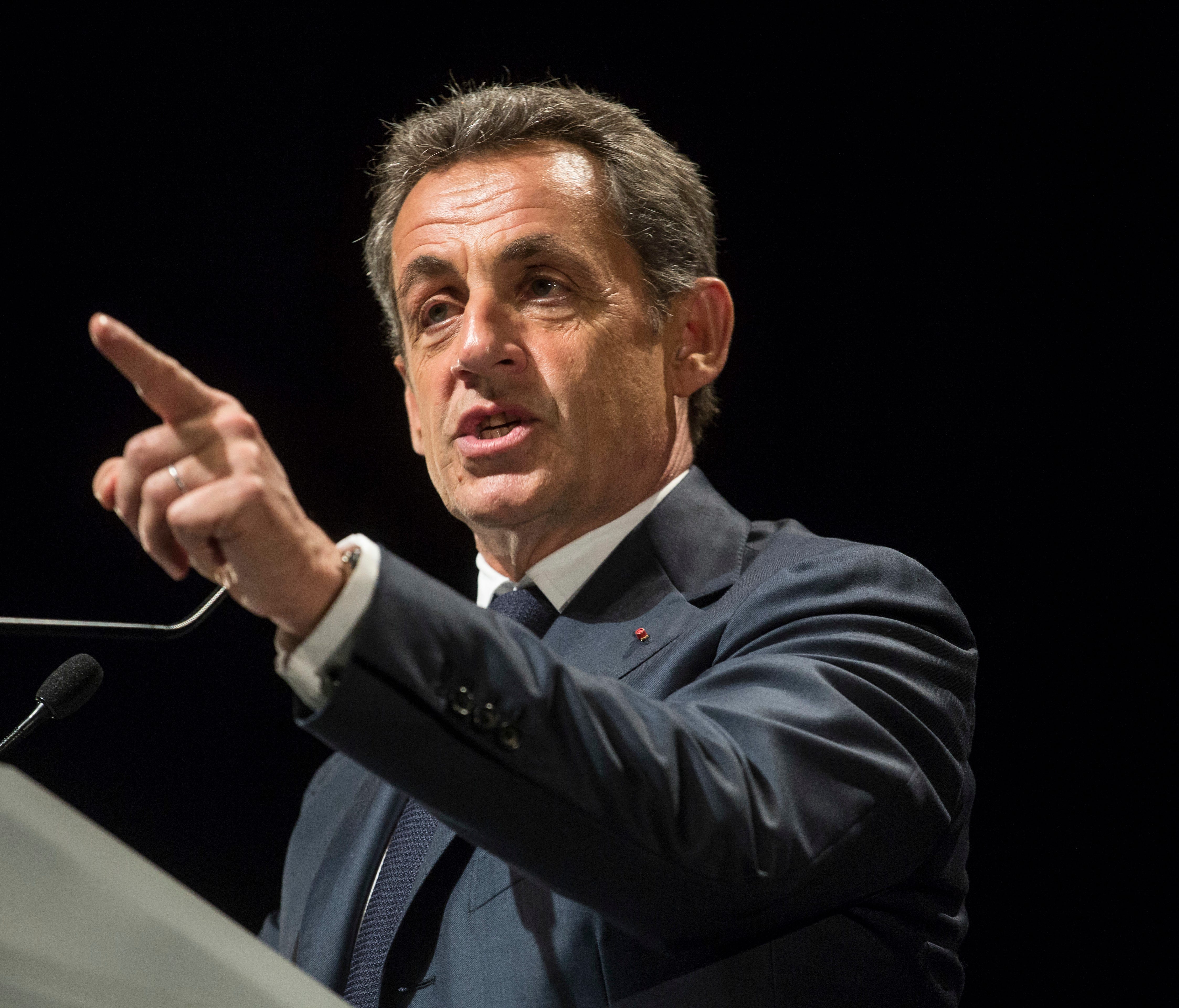 In this Wednesday, Nov. 9, 2016 file photo, former French President and candidate for France's conservative presidential primary Nicolas Sarkozy delivers a speech during a campaign meeting in Meyzieu, near Lyon, central France.