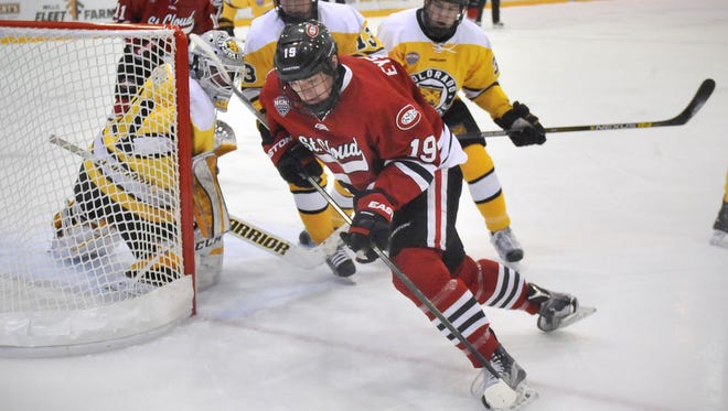 St. Cloud State's Mikey Eyssimont carries the puck past Colorado College goaltender Jacob Nehama during a game this season at the Herb Brooks National Hockey Center.