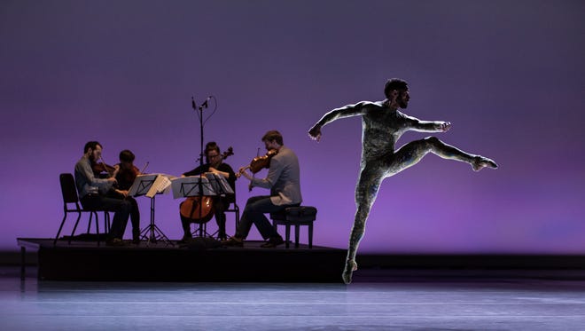 Cincinnati Ballet dancer James Gilmer is seen here with the Ariel Quartet in the world premiere of resident choreographer Adam Hougland’s “Cut to the Chase.” The work is being performed March 17-18 at the Aronoff Center as part of “Bold Moves.”