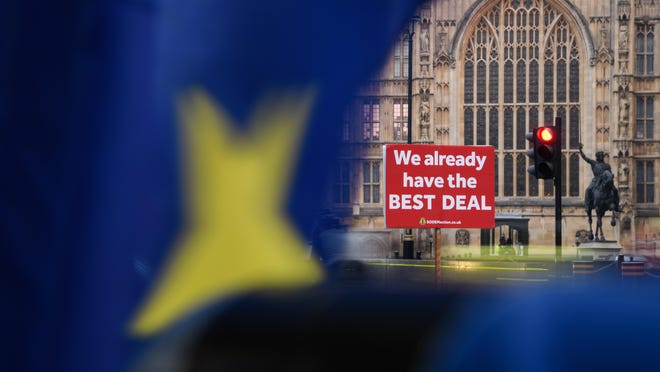 A protest placard reading "We Already Have The Best Deal" is seen near the Houses of Parliament as the week begins on Jan. 21, 2019, in London, England.