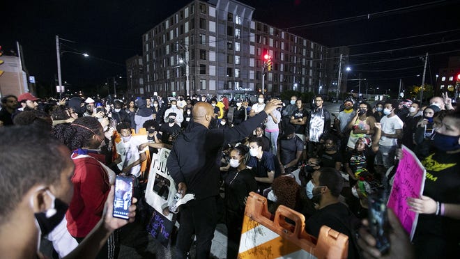 The second night of protests in Brockton in the wake of the death of George Floyd ended when youth mentor Kenny Monteiro, center, commanded the attention of the crowd around 9 p.m., which has been the city's curfew since mid-April due to the high COVID-19 infection rate. With many protesters on a knee around him, Monteiro showed profound leadership, urging the protesters that the wisest decision they could make was to leave at that time, Wednesday, June 3, 2020.