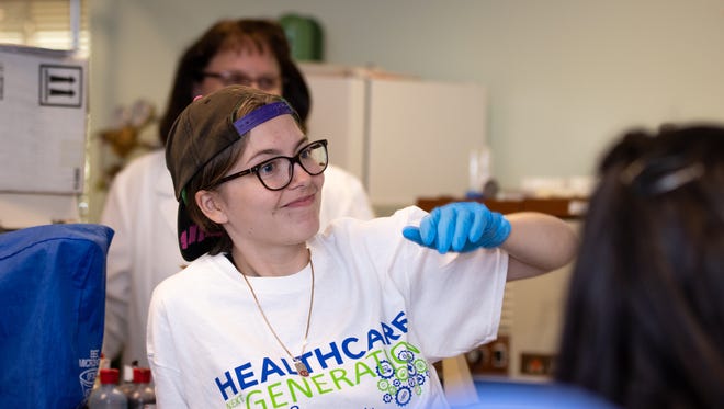 Plymouth-Canton STEM student Noelle Miller was one of more than 100 P-CEP students who traveled to Eastern Michigan University to explore possibilities in the health care field.