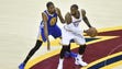 LeBron James works around Kevin Durant during the first