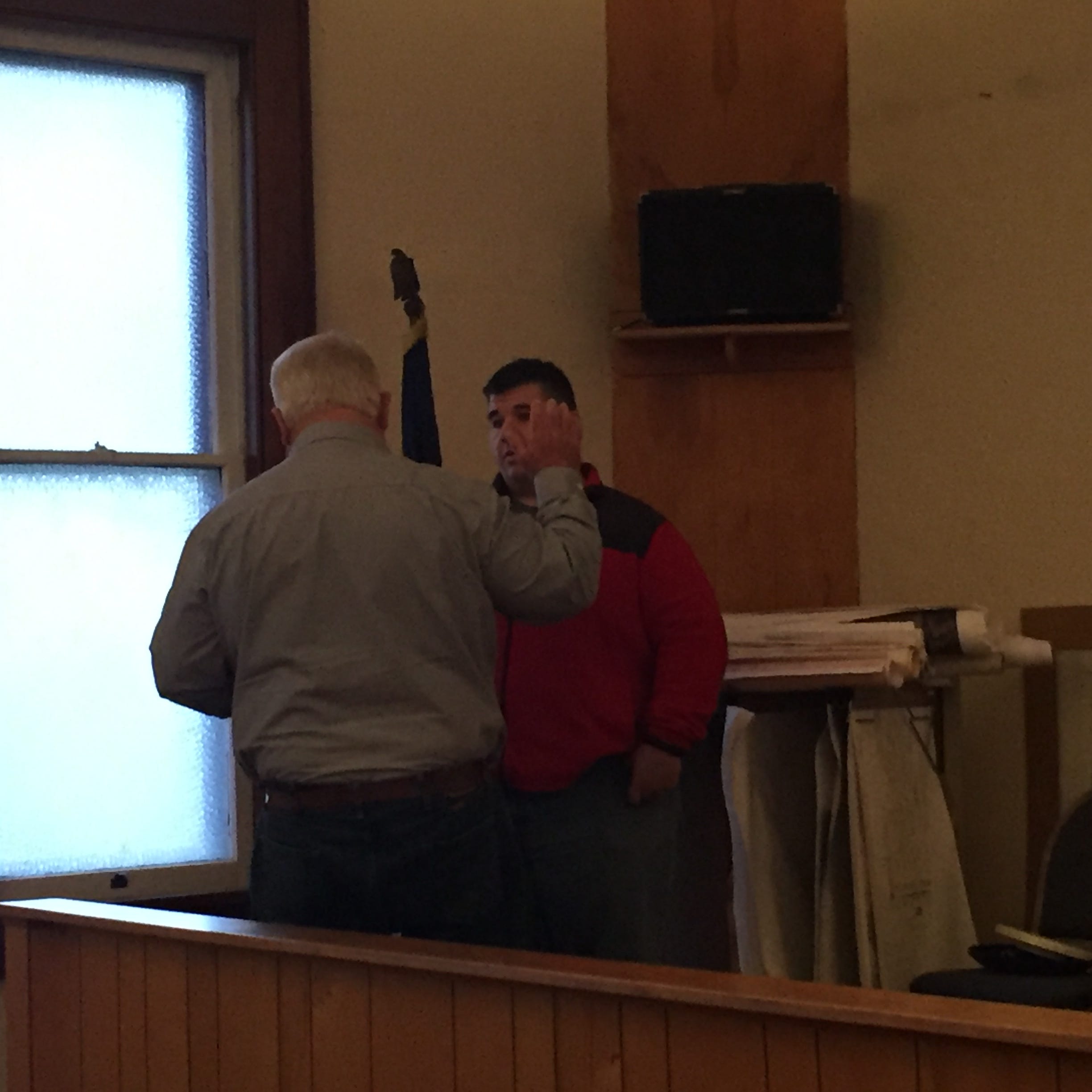 James Hughes Jr. is sworn in by Kirkersville Mayor Terry Ashcraft as the new Kirkersville Police Chief Tuesday night just moments after being approved by the village council.