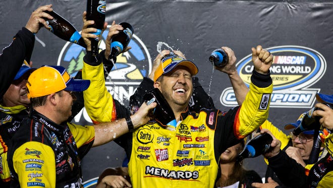 File photo of NASCAR Camping World Truck Series driver Matt Crafton celebrates with his crew after winning the 2013 championship following the Ford EcoBoost 200 at Homestead-Miami Speedway.