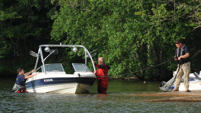 A boat is towed to Fisherman's Landing at Mashpee-Wakeby Pond where a man drowned in late June. The state Environmental Police and many fire chiefs on Cape Cod have reported an increased number of water rescue calls so far this summer.