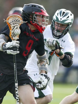 Polytech’s Connor Ott works against Archmere’s Conor Wilkinson the second half of Wednesday’s game.