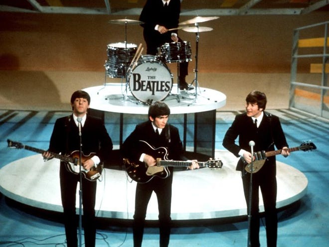 
In this Feb. 9, 1964 file photo, The Beatles, clockwise from top, Ringo Starr, John Lennon, George Harrison and Paul McCartney, perform on CBS' "Ed Sullivan Show" in New York. 
