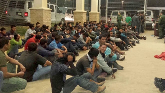 Rep. Henry Cuellar's office released photos of unaccompanied young people in a chain-fence cage at a federal Customs and Border Protection facility. The location was not disclosed.