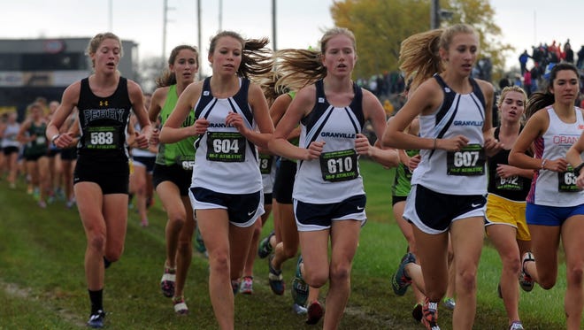 Granville's Alyssa Christian and Reilly Zink run in the state cross country meet Saturday, Nov. 4, 2017, at National Trail Raceway in Hebron.