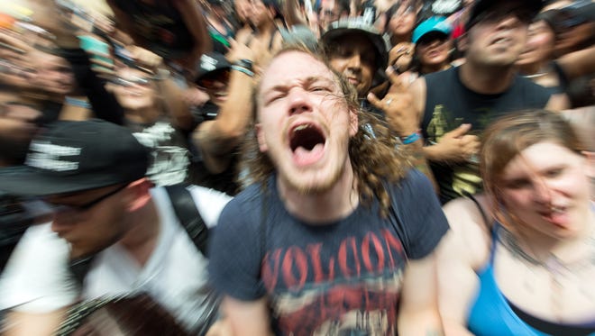 Zach Peterson, 22, of Hobbs, New Mexico, screams the lyrics of a Silverstein song on Tuesday, August 1, 2017 during the Vans Warped Tour presented by Journeys at the New Mexico State University Intramural Field. "Yes this is one of my favorite bands, I've been listening to them for the past 10 years," Peterson said.