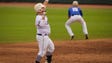 Newman Catholic's (22) Evan Paulus celebrates a double