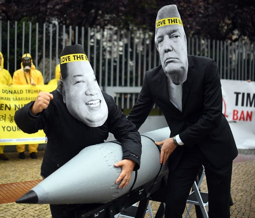 Picture taken on Sept. 13, 2017, shows activists of the International Campaign to Abolish Nuclear Weapons (ICAN) wearing masks of President Trump, right, and North Korea's leader Kim Jong Un.