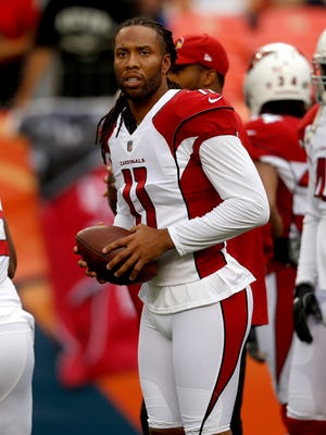 Arizona Cardinals wide receiver Larry Fitzgerald (11) warms up prior to an NFL preseason football game against the Denver Broncos, Thursday, Aug. 31, 2017, in Denver.
