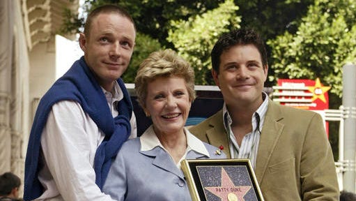FILE - In this Aug. 17, 2004, file photo, Academy Award winner, and television actress Patty Duke poses with her sons, actors Mackenzie Astin, left, and Sean Astin after being honored with a star on the Hollywood Walk of Fame in Los Angeles. There’s a story behind every one of the 50,000-plus runners in Sunday’s New York City Marathon. Actor Sean Astin will take part in his first New York City Marathon although he’s run a dozen marathons in other cities.
He said the race will be poignant because New York was the birthplace of his mother, actress Patty Duke, who died in March.