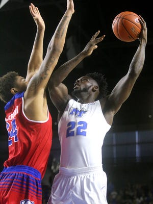 MTSU's JaCorey Williams (22) goes up for a shot as La Tech's Omar Sherman (24) guards him on Saturday, Jan. 28, 2017.