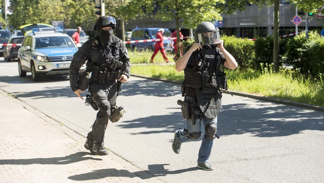 Heavily-armed police outside a movie theatre complex where an armed man has reportedly opened fire on June 23, 2016 in Viernheim, Germany. According to initial media reports, the man entered the cinema today at approximately 3pm, fired a shot in the air and barricaded himself inside. 