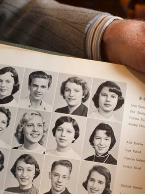 Matthew McClellan shows his 1955 West High School yearbook with personal inscriptions from Phil and Don Everly on Friday, Jan. 10, 2014, in Bearden. The sophomore class photo of Phil Everly is on the top row.