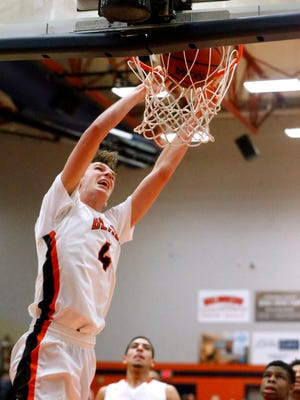 Blackman's Nathan Nelson (4) dunks the ball during the game against Riverdale on Tuesday, Jan. 9, 2018, at Blackman.