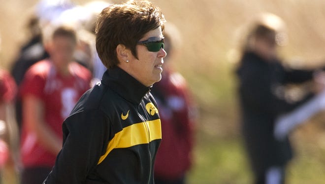 In this photo provided by the University of Iowa athletics department Hawkeyes, women?s field hockey coach Tracey Griesbaum watches the team from the sidelines. Griesbaum, who led the Hawkeyes to success during a 14-year tenure, says she was fired after a group of former players falsely claimed that she mistreated them and that she did nothing to warrant being relieved from her post. (AP Photo/University of Iowa)