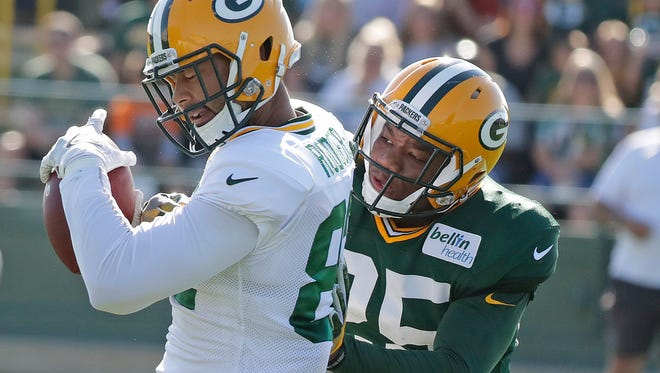 Green Bay Packers tight end Richard Rodgers (82) makes a catch against cornerback Marwin Evans (25) during training camp at Ray Nitschke Field July 29, 2016.